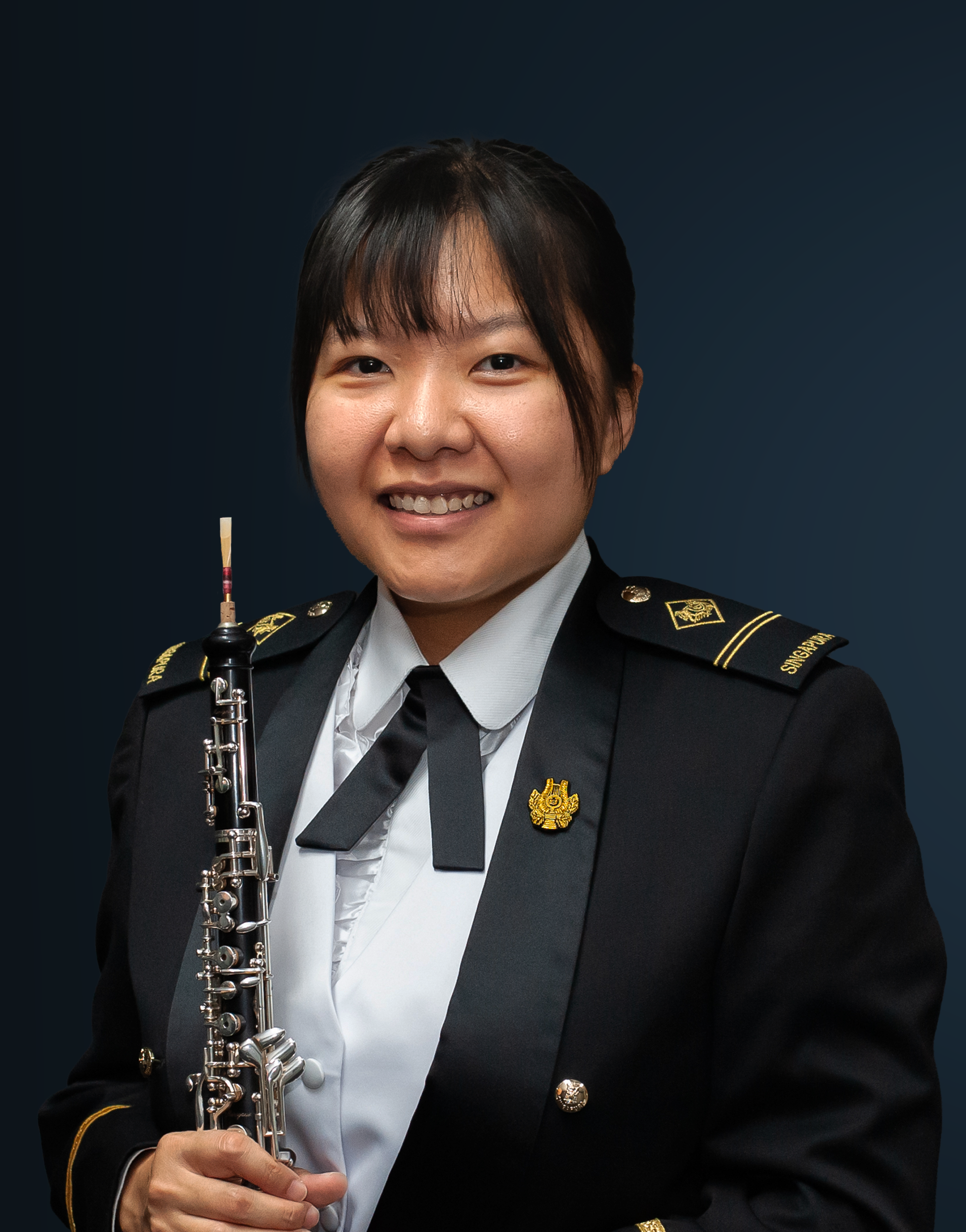 Headshot of Principal Oboe ME2 Leow Rui Qing in concert dress.